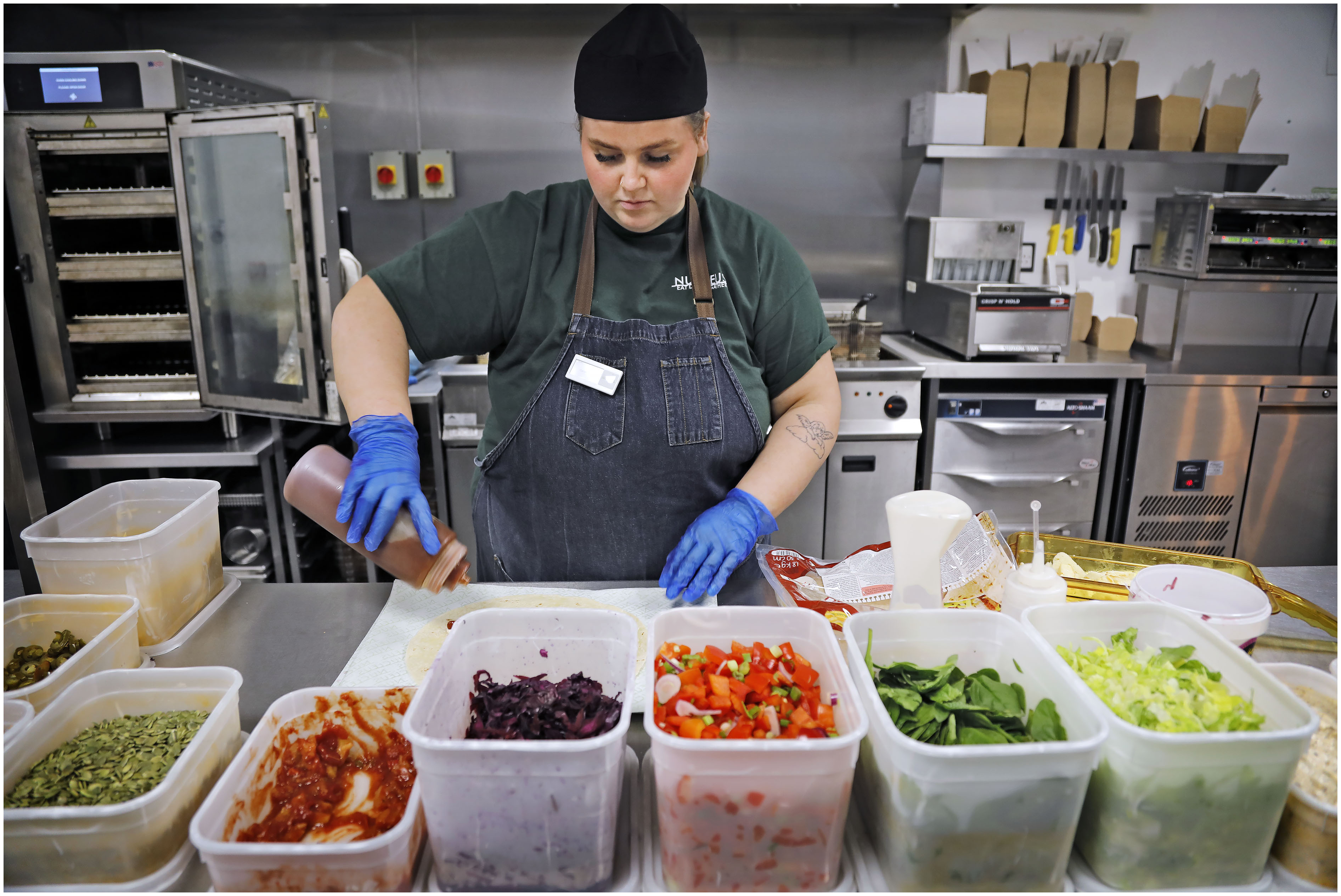 A member of staff preparing food