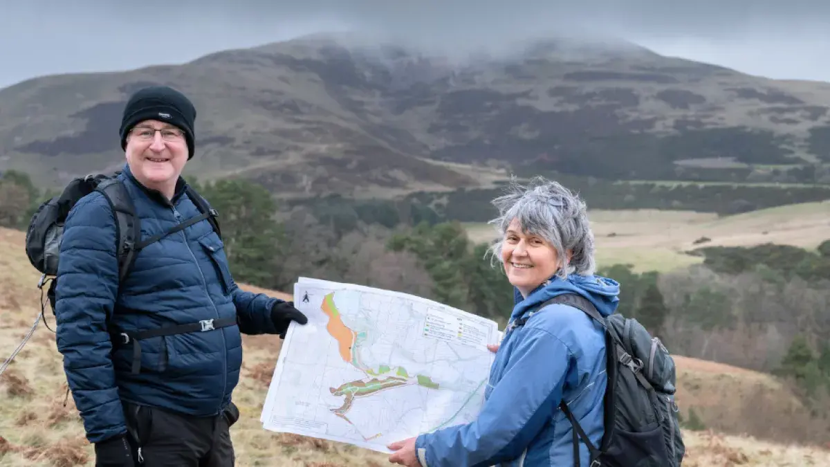 Colleagues in Drumbrae holding a map