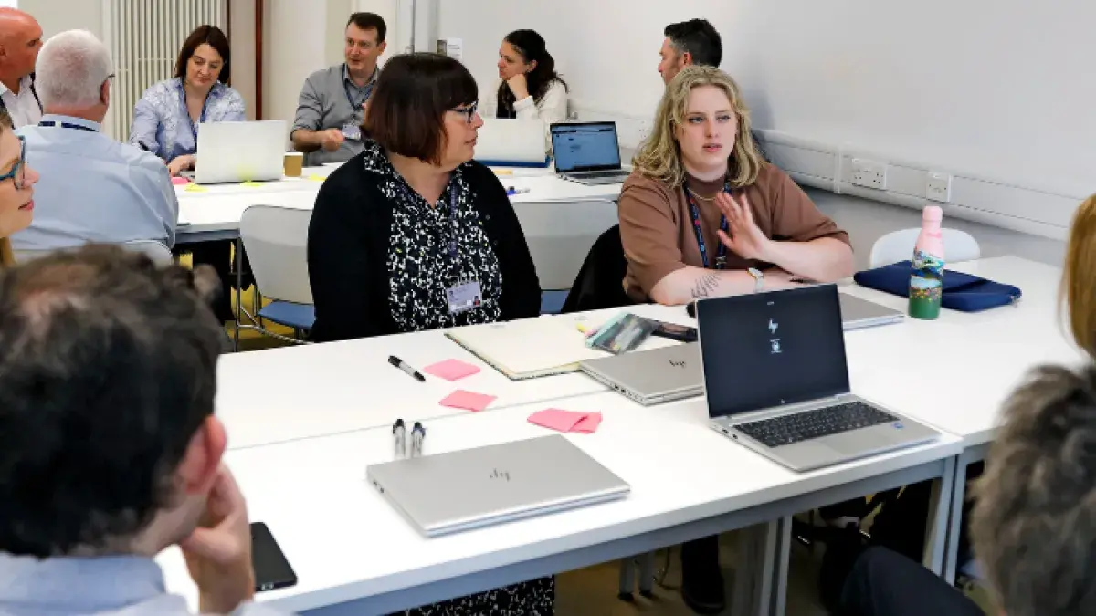 A group of colleagues working around  atable