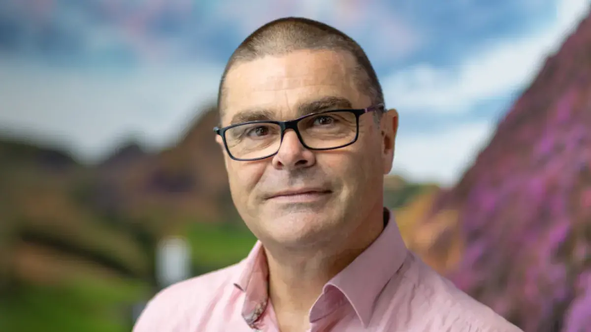 A headshot of James Saville