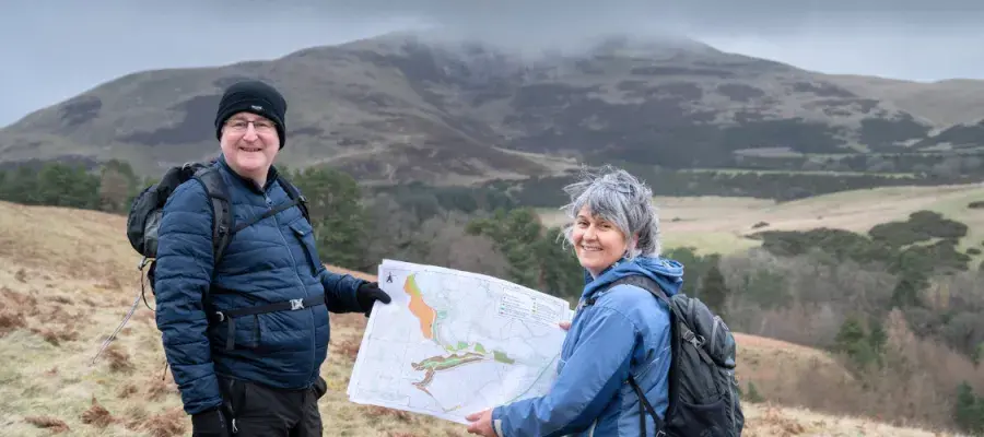 Colleagues in Drumbrae holding a map