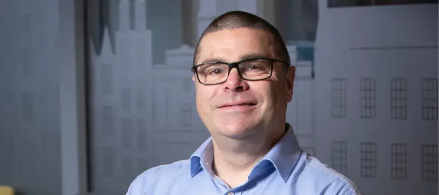 A headshot of James Saville