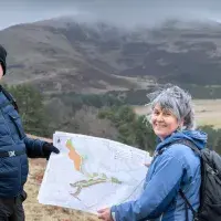 Colleagues in Drumbrae holding a map