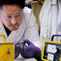 A member of the radiation unit inspects equipment