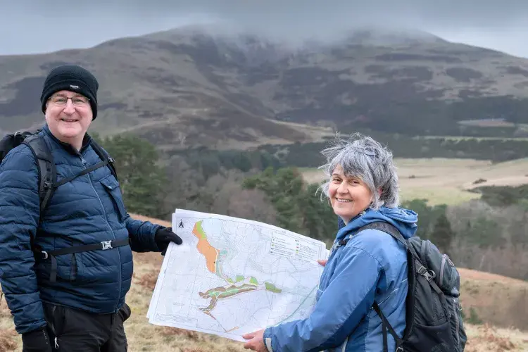 Colleagues in Drumbrae holding a map